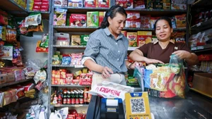 Les ménages commerciaux utilisent des codes QR pour les paiements sans numéraire, contribuant ainsi à la promotion de la finance inclusive.
