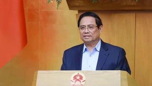 Le Premier ministre Pham Minh Chinh lors de la réunion ordinaire du gouvernement de février. Photo: VNA 