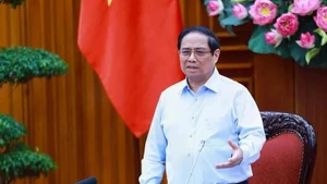 Le Premier ministre Pham Minh Chinh assume la direction du Comité de pilotage des centres financiers régional et international du Vietnam. Photo : VNA.