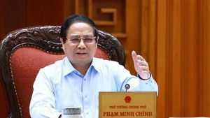 Le Premier ministre Pham Minh Chinh s’exprime lors de la réunion, à Hanoi, le 22 avril. Photo : VNA. 