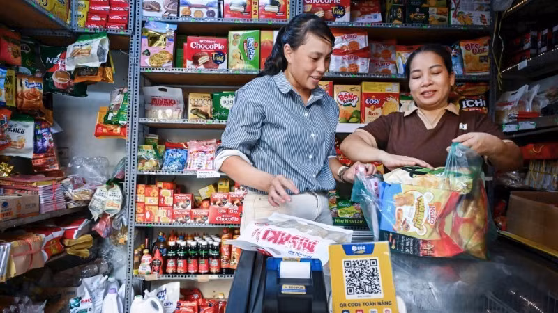 Les ménages commerciaux utilisent des codes QR pour les paiements sans numéraire, contribuant ainsi à la promotion de la finance inclusive.