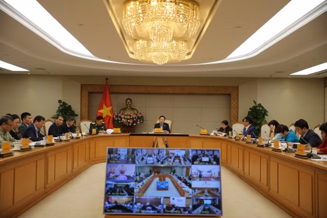 Vue de la réunion hybride consacrée aux projets de décrets d’application de la résolution n°254/2025/QH15 de l’Assemblée nationale. Photo : VNA