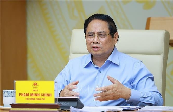 Le Premier ministre vietnamien Pham Minh Chinh demande de maintenir l'équilibre pour préserver la santé publique. Photo : VNA.