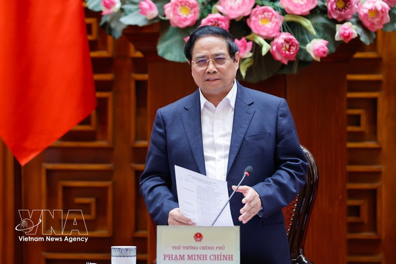 Le Premier ministre Pham Minh Chinh préside une séance de travail entre la Permanence du gouvernement et les dirigeants de Hanoï afin de donner des avis sur le Plan directeur global de la capitale Hanoï avec une vision à 100 ans. Photo : VNA.