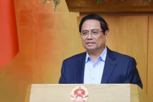 Le Premier ministre Pham Minh Chinh lors de la réunion ordinaire du gouvernement de février. Photo: VNA 
