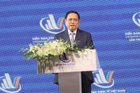 Le Premier ministre Pham Minh Chinh s'exprime lors du 4e Forum économique du Vietnam 2022 à Hô Chi Minh-Ville. Photo : nhandan.vn
