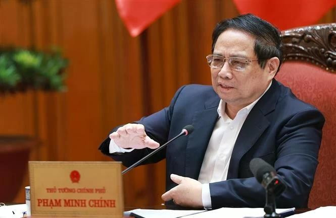 Le Premier ministre Pham Minh Chinh lors de la réunion, à Hanoi, le 1er juillet. Photo : VNA.
