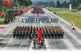 L’Armée populaire avance résolument sous le drapeau glorieux du Parti