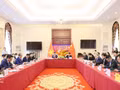 Des délégués participent au Programme de coopération et d’échanges sur l’industrie verte Vietnam-Chine. Photo : VNA.