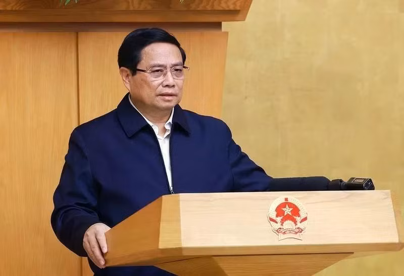 Le Premier ministre Pham Minh Chinh préside la réunion périodique de janvier du gouvernement. Photo : VNA. 