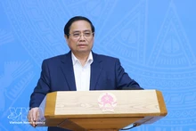 Le Premier ministre Pham Minh Chinh s'exprime lors de la conférence. Photo : VNA.