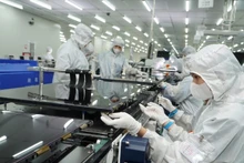 Production à la société à responsabilité limitée Coretronic Vietnam High Technology, l’un des projets de haute technologie de la ville de Ho Chi Minh-Ville. Photo : NDEL.