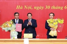 Le Premier ministre vietnamien Pham Minh Chinh (centre), Tran Duc Thang et Ho Van Nien Photo : VNA.
