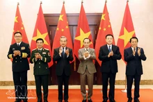 Les ministres des Affaires étrangères, de la Défense et de la Sécurité publique du Vietnam et de la Chine lors de la premier réunion du Dialogue stratégique « 3+3 ». Photo : VNA