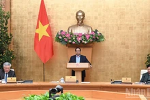Le Premier ministre Pham Minh Chinh préside la réunion de la Permanence du gouvernement dans l'après-midi du 22 février. Photo : NDEL.