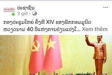 L’éditorial intitulé « Le XIVe Congrès du Parti communiste du Vietnam, jalon des 40 ans du Renouveau », publié par le journal Pasaxon, organe du Parti populaire révolutionnaire lao. Photo : VNA.