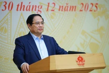 Le Premier ministre Pham Minh Chinh prend la parole lors de la conférence. Photo : VNA.