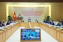 Vue d'ensemble de la conférence nationale, à Hanoi, le 30 décembre. Photo: VNA