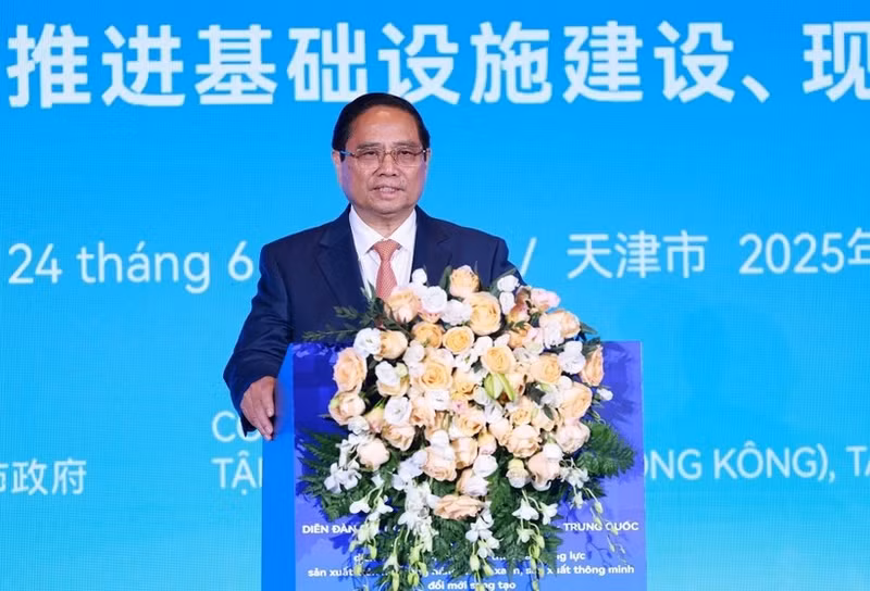 Le Premier ministre Pham Minh Chinh s'exprime lors du Forum des entreprises Chine-Vietnam. Photo: VNA.