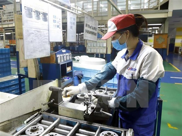 Production dans la société Exedy Vietnam implantée dans la zone industrielle de Khai Quang, province de Vinh Phuc (Nord). Photo: VNA