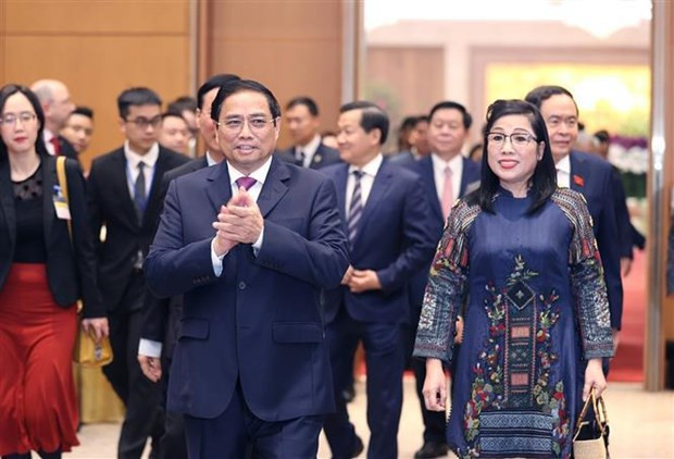 Le Premier ministre Pham Minh Chinh et son épouse présidant un banquet en l’honneur du corps diplomatique à Hanoi, avant la fête traditionnelle du Nouvel An lunaire (Têt). Photo : VNA.