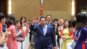 Le Premier ministre Pham Minh Chinh a rencontré des représentants de la communauté vietnamienne en Chine le 31 août. Photo : VGP.