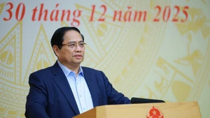Le Premier ministre Pham Minh Chinh prend la parole lors de la conférence. Photo : VNA.