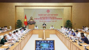 Première réunion du Comité directeur national pour la défense civile, le 24 juillet à Hanoi. Photo : VNA.