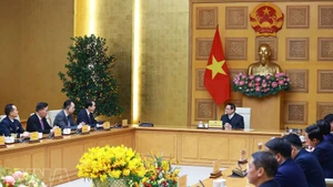 Le Premier ministre Pham Minh Chinh reçoit l'ambassadeur de Chine au Vietnam, He Wei. Photo : VNA.