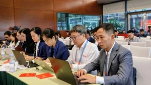 Les journalistes au Centre de presse du XIVᵉ Congrès du Parti. Photo : The Dung.