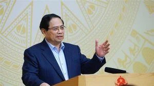 Le Premier ministre Pham Minh Chinh; chef du Comité directeur national chargé de la mise en œuvre de la Résolution n°79-NQ/TW du Bureau politique sur le développement de l’économie publique. Photo : VNA.