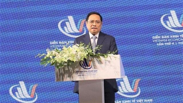 Le Premier ministre Pham Minh Chinh s'exprime lors du 4e Forum économique du Vietnam 2022 à Hô Chi Minh-Ville. Photo : nhandan.vn