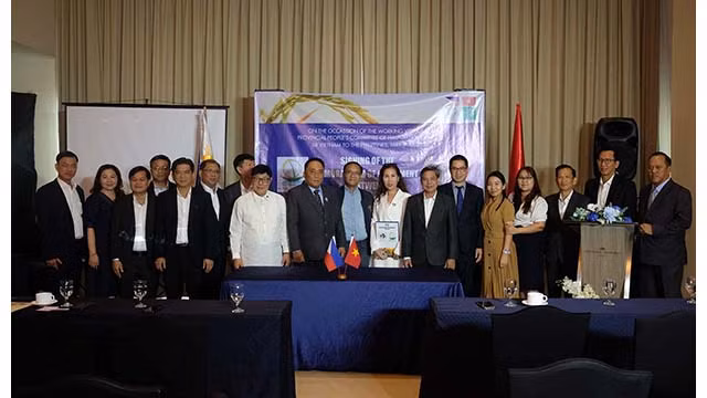 Les délégués lors de la cérémonie de signature de mémorandum de coopération. Photo: baoquocte.vn