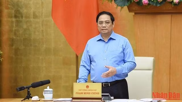 Le Premier ministre Pham Minh Chinh préside la réunion périodique d'août du gouvernement, le 5 septembre. Photo : NDEL.