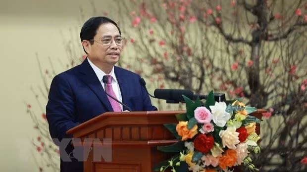 Le Premier ministre Pham Minh Chinh s'exprime lors de la rencontre. Photo: VNA