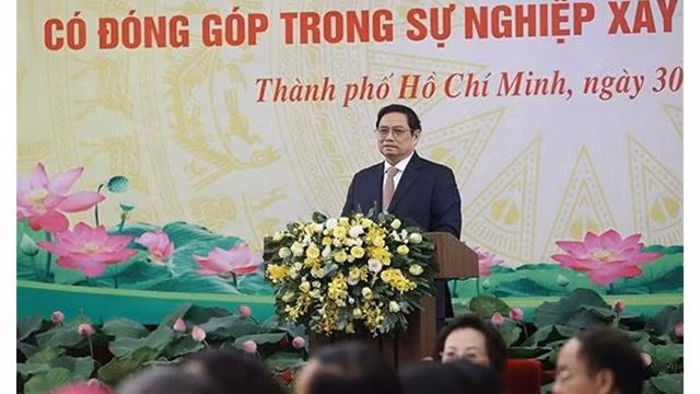 Le Premier ministre Pham Minh Chinh préside la conférence en l’honneur des organisations religieuses. Photo: VNA