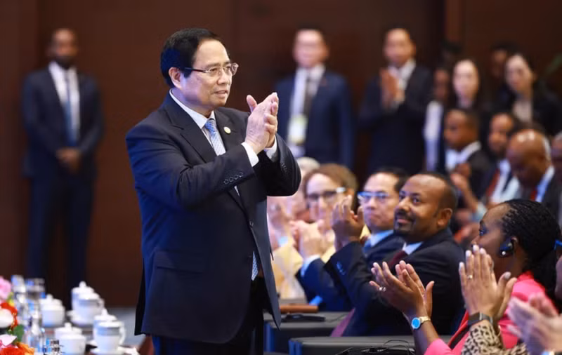 Le Premier ministre Pham Minh Chinh et des délégués à la cérémonie de clôture. Photo: VNA