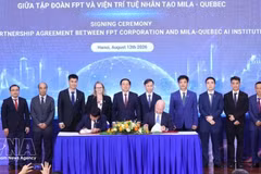 Signature de l'accord de coopération stratégique pour la prochaine phase entre le groupe FPT et Mila. Photo : VNA. 