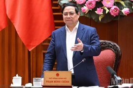 Le Premier ministre Pham Minh Chinh s'exprime lors de la réunion du 10 mars. Photo: NDEL.