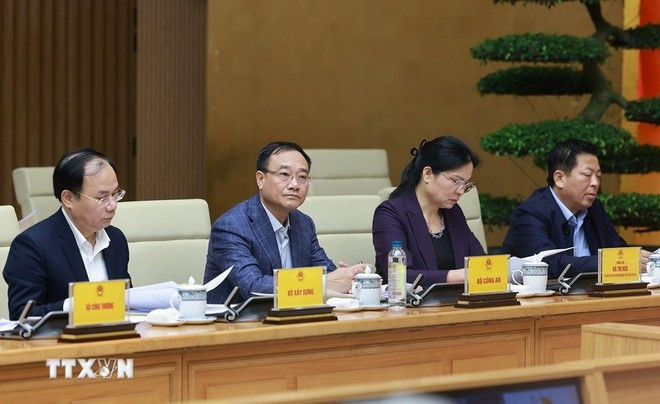 Les délégués assistent à la réunion. Photo: VNA