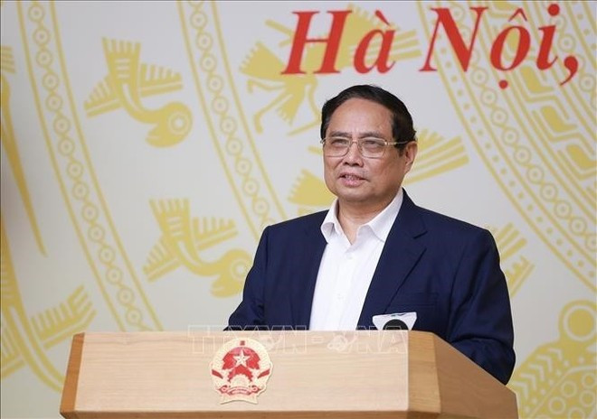Le Premier ministre Pham Minh Chinh s'exprime lors de la conférence. Photo : VNA. Le Premier ministre Pham Minh Chinh s'exprime lors de la conférence. Photo : VNA.
