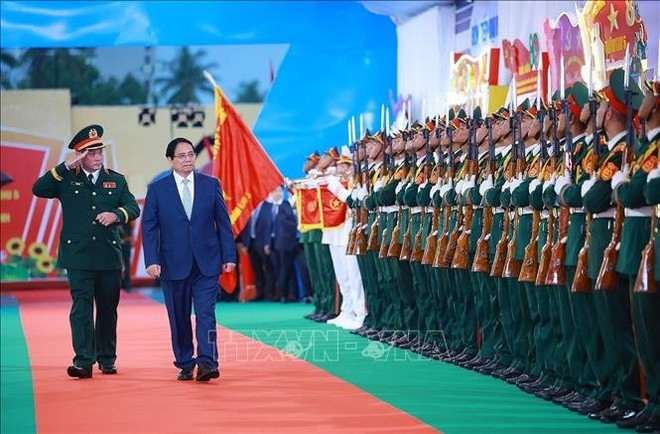 Le Premier ministre Pham Minh Chinh assiste au 80e anniversaire de la Journée traditionnelle des forces armées de la 5ᵉ Région militaire. Photo: VNA Le Premier ministre Pham Minh Chinh assiste au 80e anniversaire de la Journée traditionnelle des forces armées de la 5ᵉ Région militaire. Photo: VNA