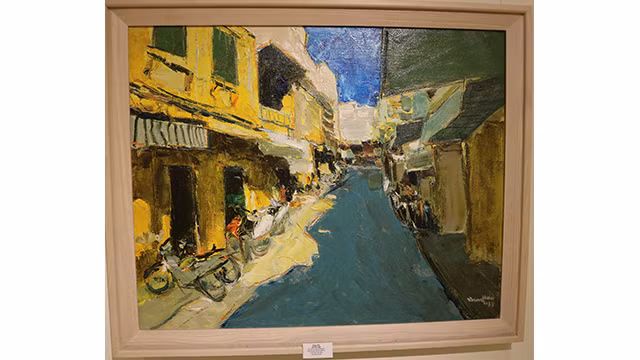 Exposition de peintures sur la capitale Hanoi ảnh 4