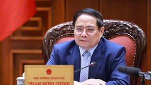 Le Premier ministre Pham Minh Chinh lors de la réunion, à Hanoi, le 28 juin. Photo : VGP.