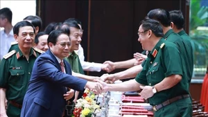 Le Premier ministre Pham Minh Chinh à la conférence politico-militaire de l'Armée. Photo: VNA
