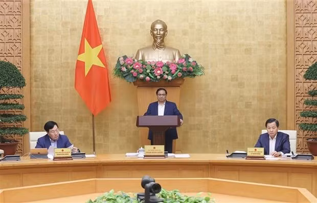Le PM Pham Minh Chinh préside la réunion de décembre du gouvernement. Photo : VNA.