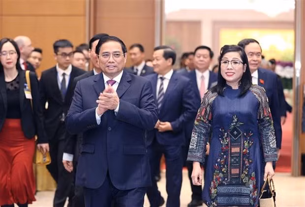 Le Premier ministre Pham Minh Chinh et son épouse présidant un banquet en l’honneur du corps diplomatique à Hanoi, avant la fête traditionnelle du Nouvel An lunaire (Têt). Photo : VNA.