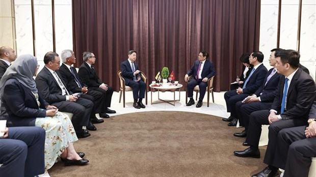 Le Premier ministre Pham Minh Chinh reçoit le deuxième ministre des Finances et de l’Économie du Brunei, Dato Seri Setia Dr Awang Haji Mohd Amin Liew Abdullah. Photo : VNA.