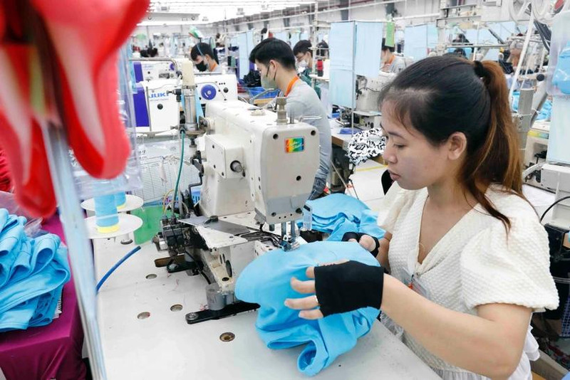 La hausse des droits de douane annoncée les Etats-Unis est une immense difficulté pour le secteur des produits textiles et d'habillement. Photo : VNA.