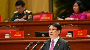 Le président de la République Luong Cuong présente le discours d’ouverture du XIVe Congrès national du Parti. Photo : Nhandan.vn